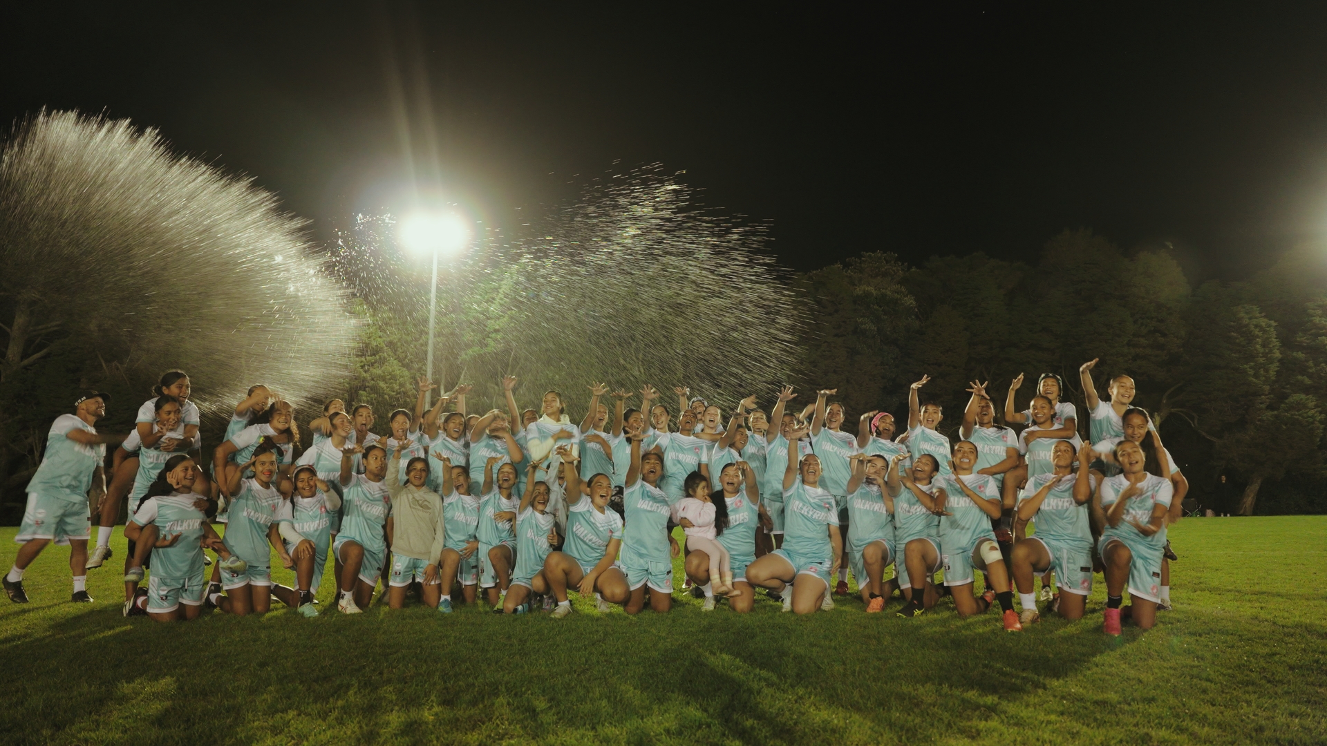 The Valkyries, the New Lynn Stags girls’ rugby league team, lined up and cheering