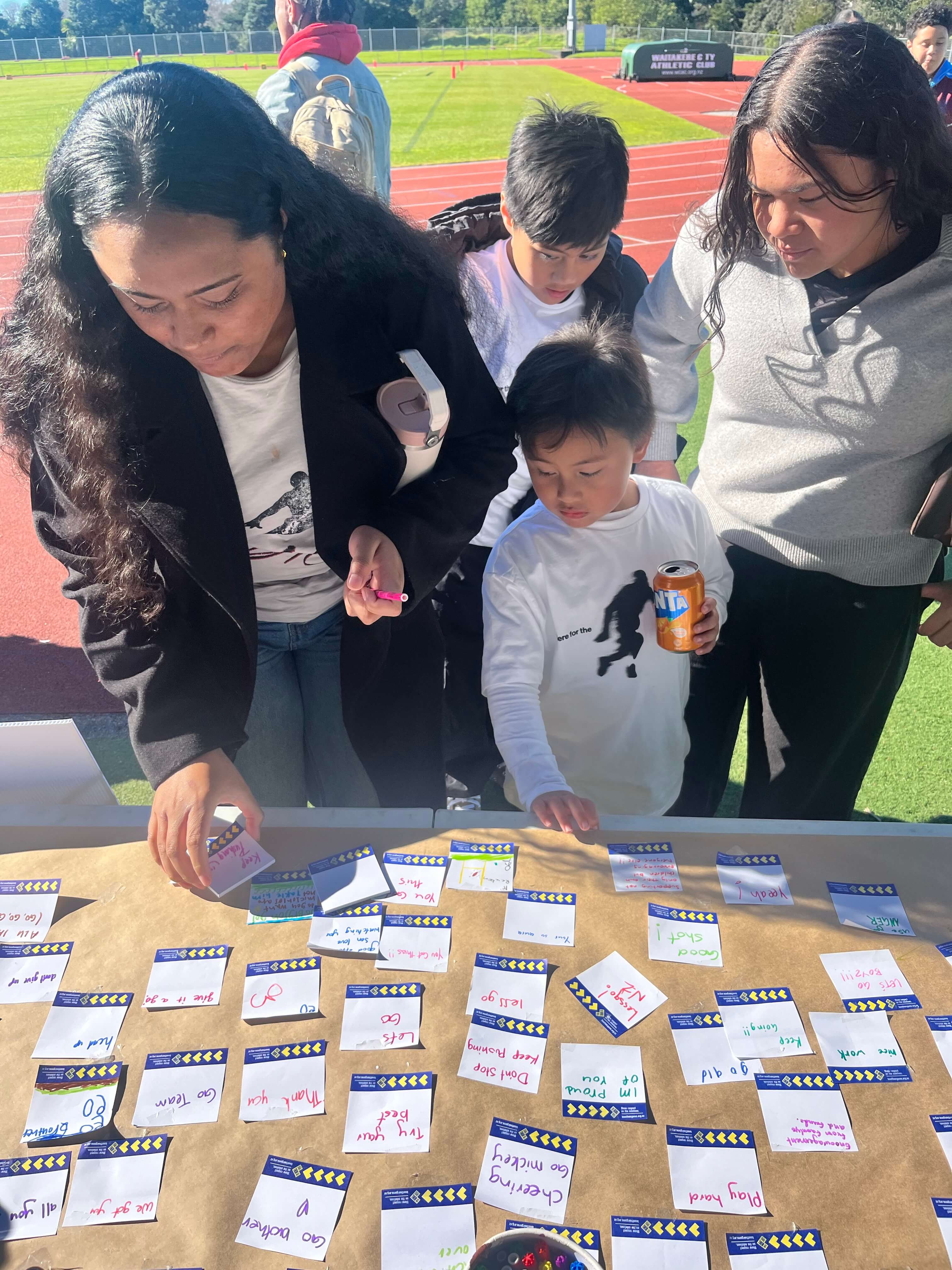 Whānau writing and sharing positive words and messages that they value hearing on the sideline