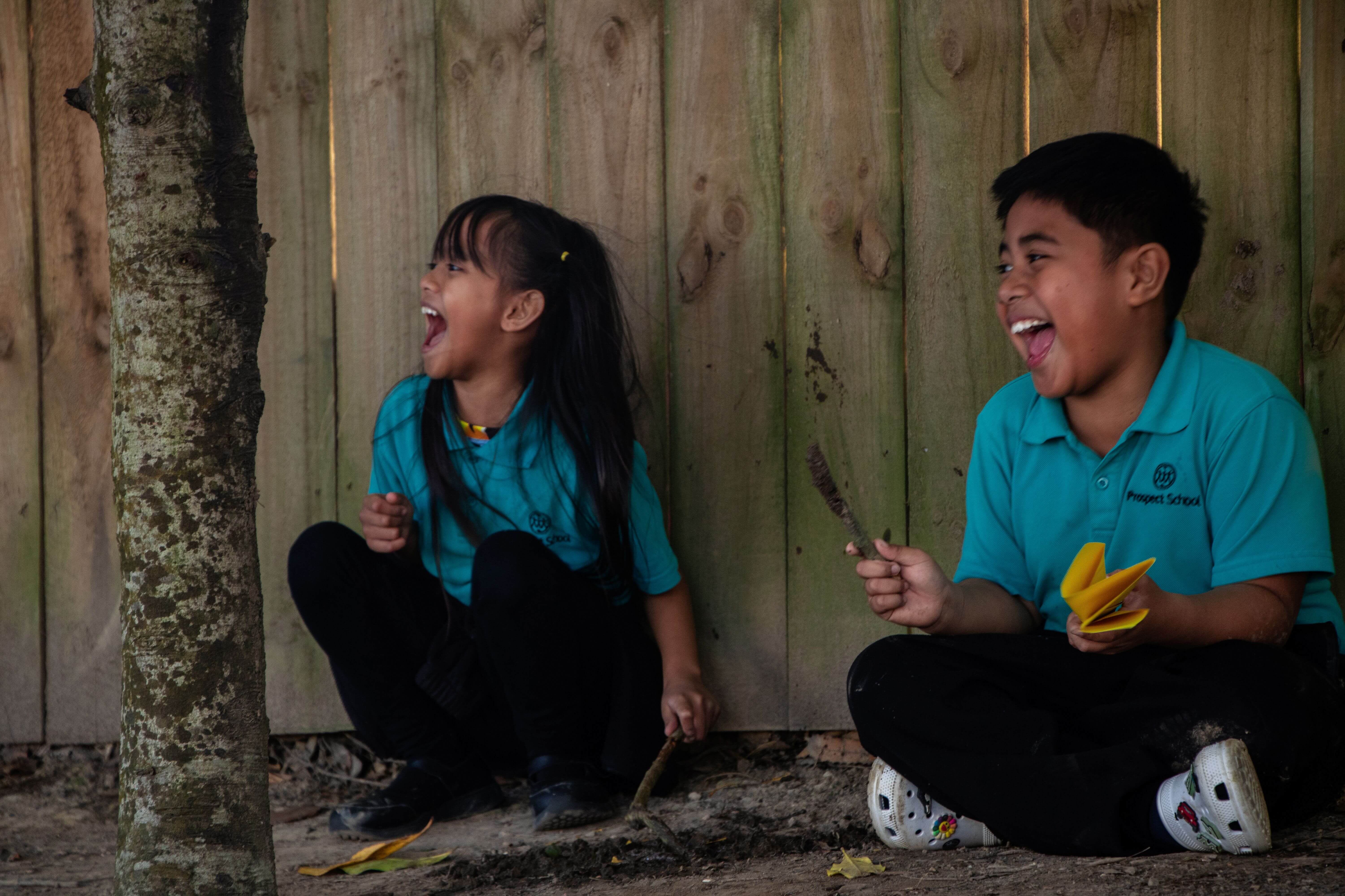 Tamariki laughing as they play